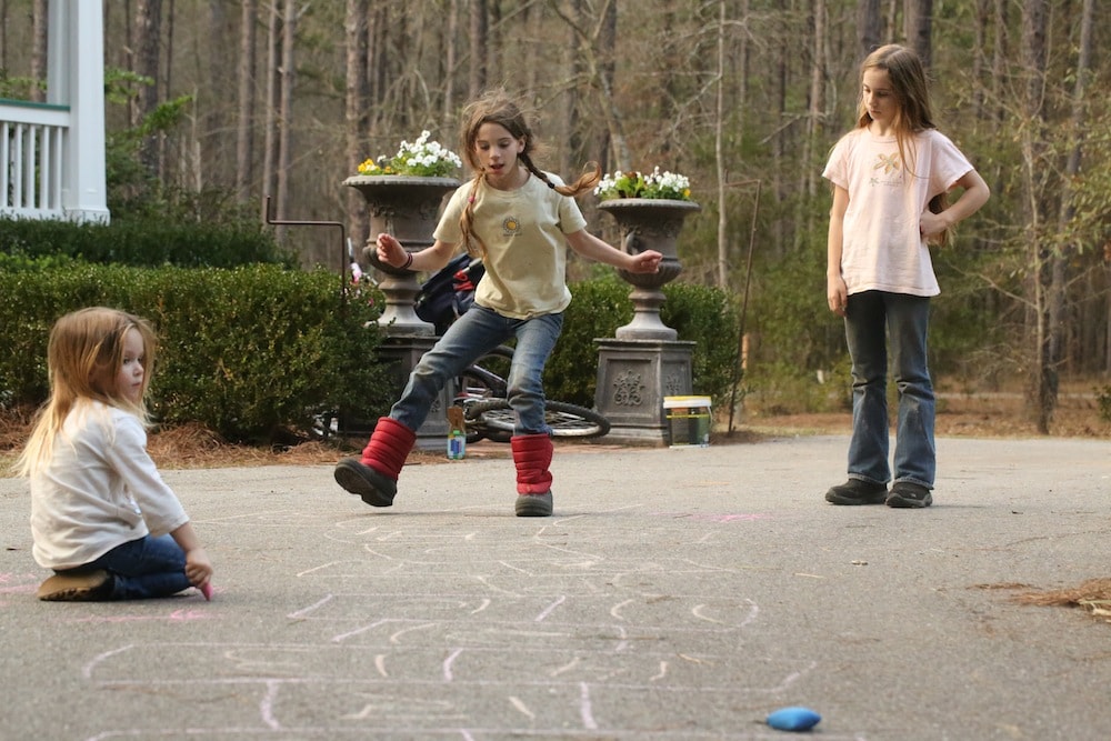 Children playing hopscotch to illustrate the point about getting exercise while being a young mom