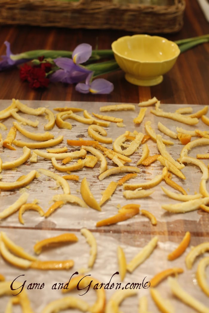Allow the orange peels to dry for about 12 hours. They will not be completely dry when you coat them with sugar.