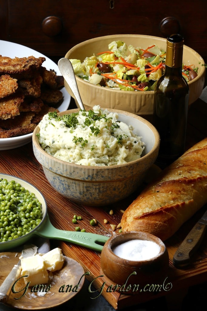 Hunter's Birthday Meal consists of fried deer meat, a loaded salad, garlic mashed potatoes, English peas (he used to call them circle peas when he was 2), and fresh bread. Yummy!!