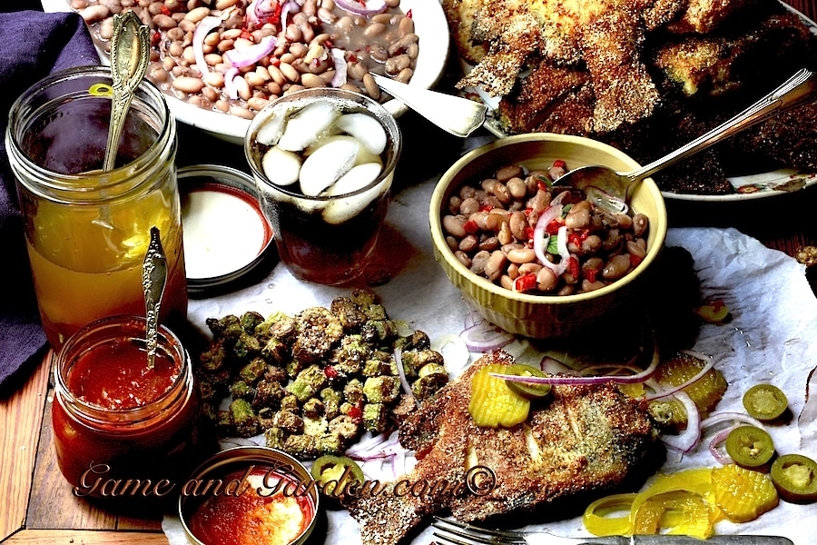 The Southern Table with Fried Bream, Southern Fried Okra, and beans. This is fantastic served with pickled okra, homemade ketchup, and pickled jalapeños! 