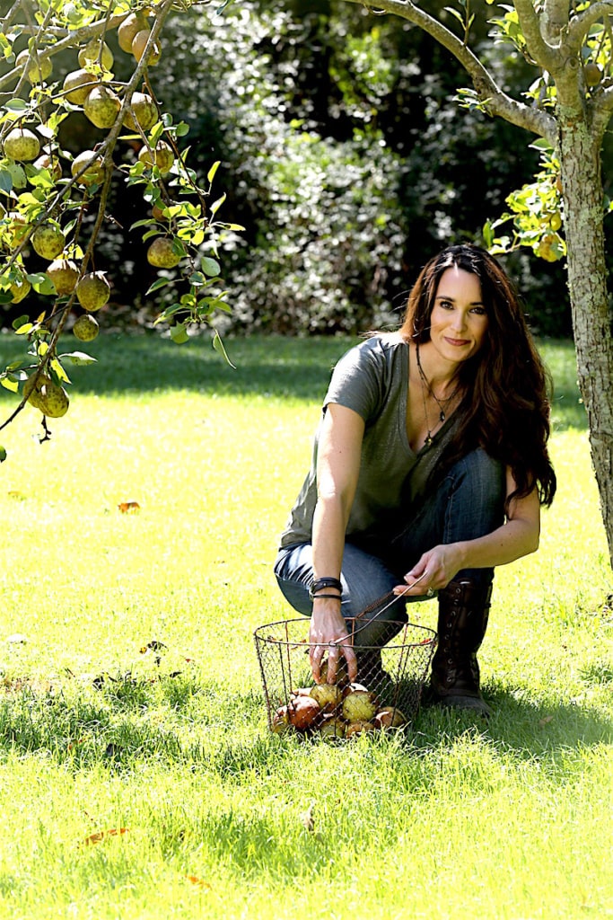 Stacy Lyn picking up pears