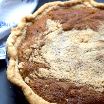 Spicy Southern Pie has the texture of a chess pie and the spices of a pumpkin pie! It's super great for the holidays with ice cream or just about anytime.