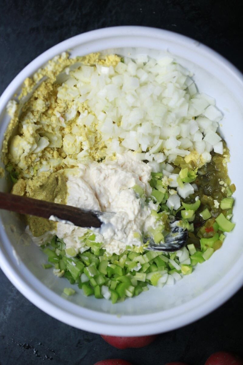 Freshly chopped onions, celery, and potatoes for potato salad.