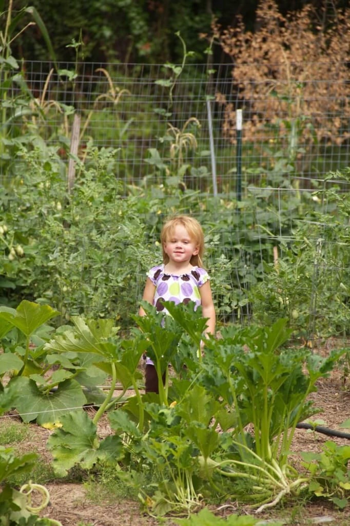 Stacy's daughter posing in the garden
