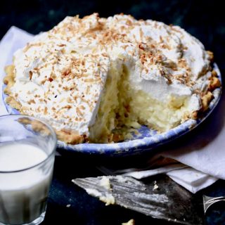 Coconut pie topped with whipped cream