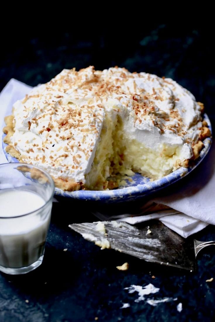 Coconut pie topped with whipped cream