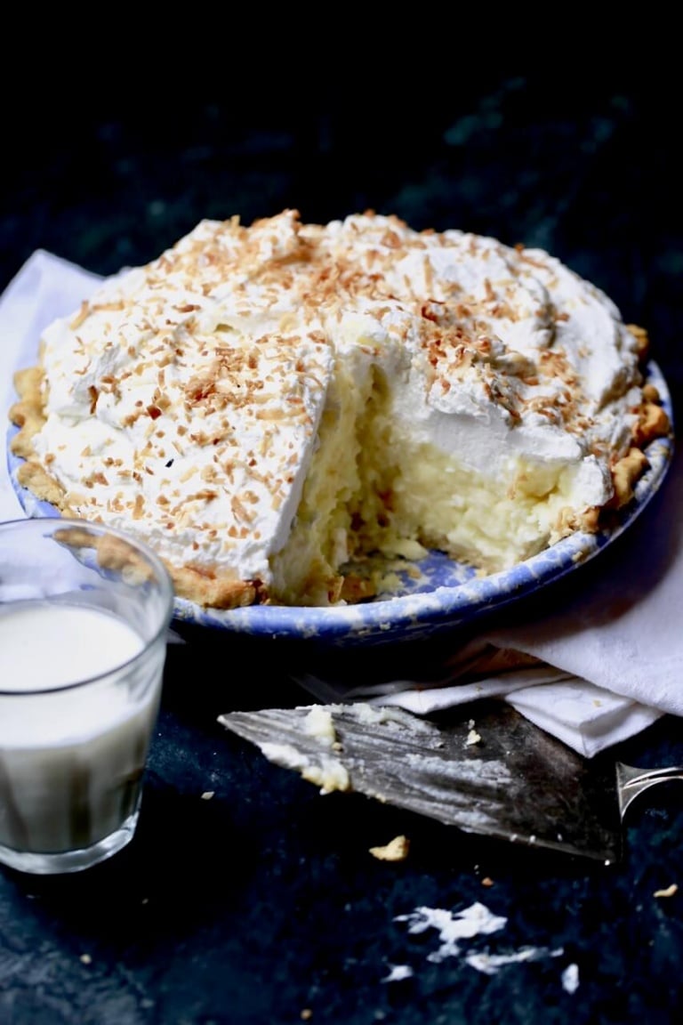 Coconut pie topped with whipped cream