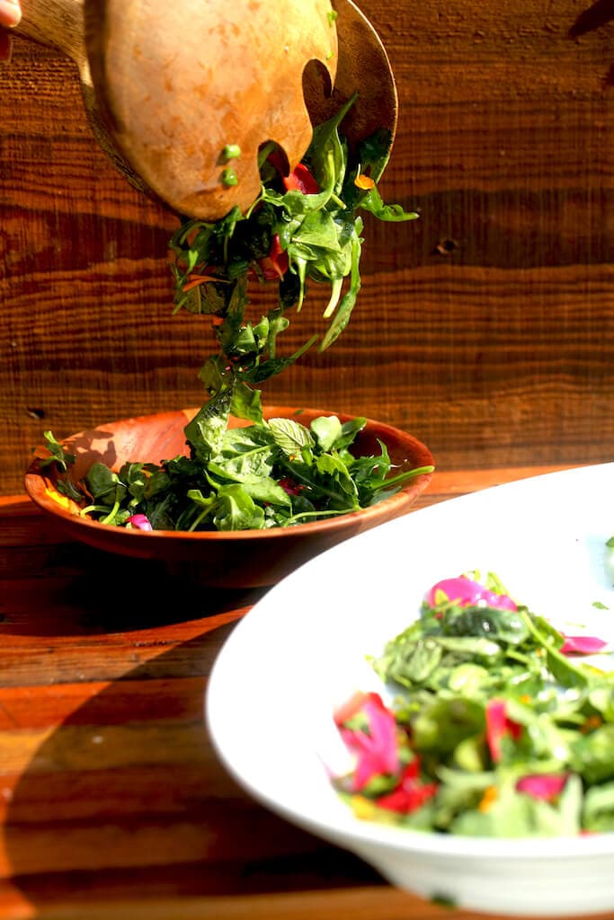 herb salad with simple vinaigrette and edible flowers and fruit