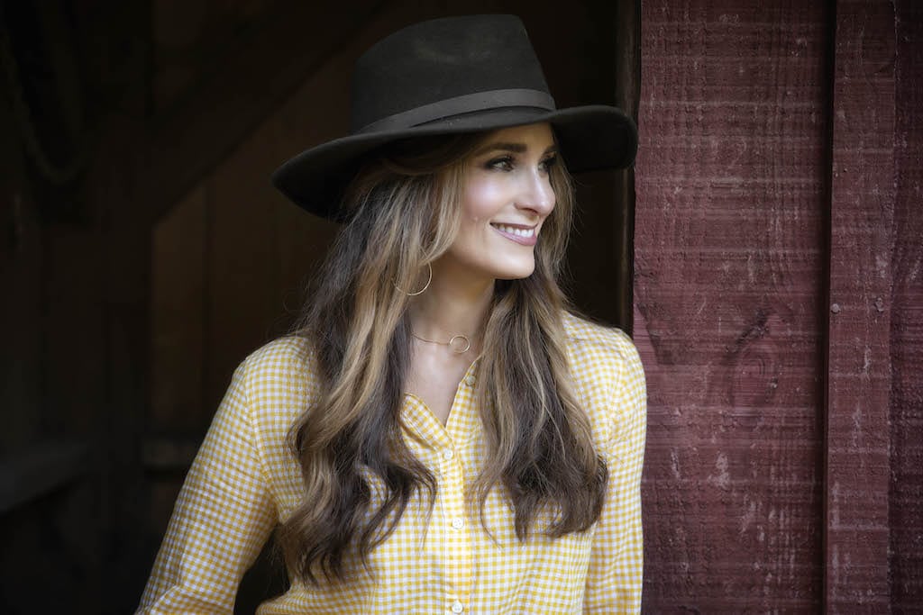Stacy Lyn Harris with a hat head shot