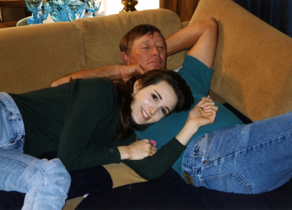 Stacy Lyn as a teen lounging on sofa with her dad