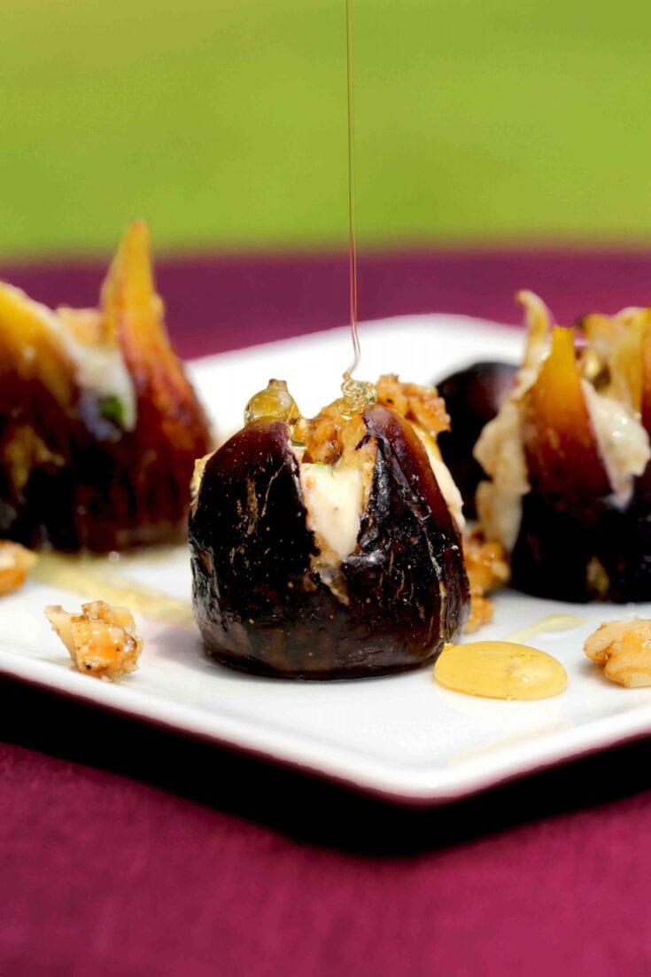Figs baked and stuffed with honey mascarpone cheese filling drizzled with honey