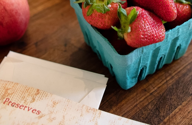 Pack of strawberries and other items on the table