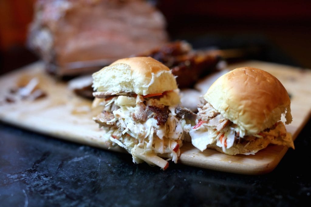 Smoky roasted pulled pork sliders with coleslaw made with mustard and apples