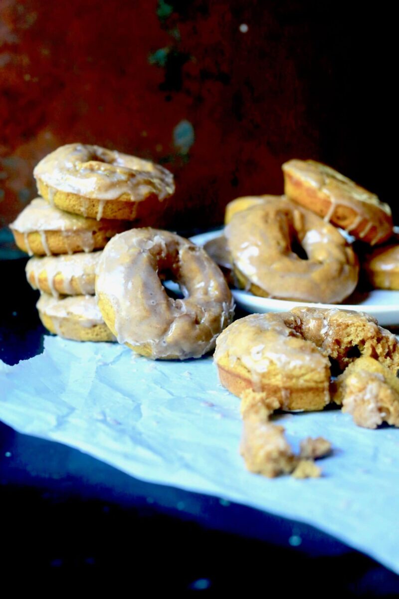 Donuts with Maple Topping on blue cloth with orange background