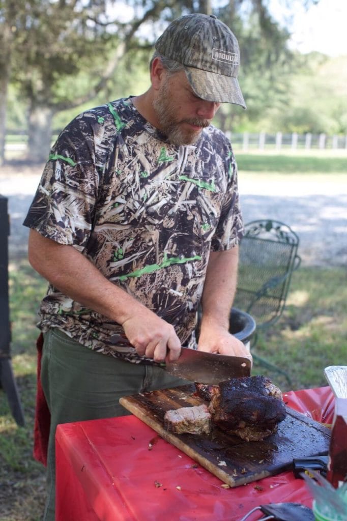 Scott Harris in the dove hunt cutting into the smoked meats