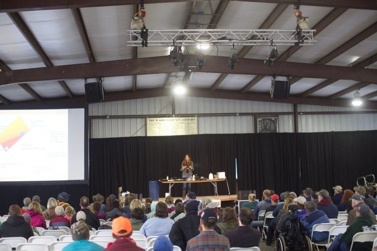 Stacy Lyn Harris speaking at the Homesteader's of America Conference in the Lehman's Barn
