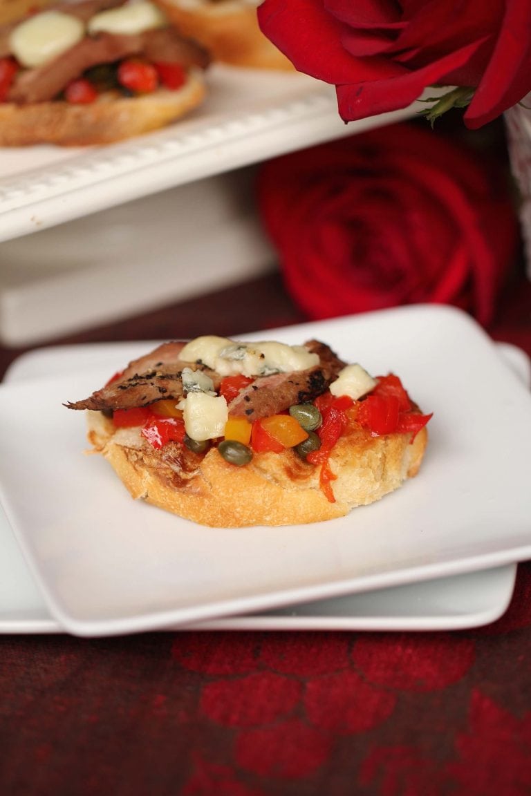 Bruschetta hors d'oeuvres with mediteranean ingredients plus venison