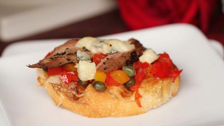 Bruschetta hors d'oeuvres with mediteranean ingredients plus venison