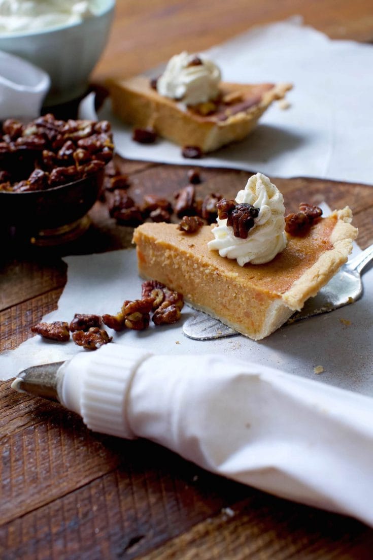 Southern sweet potato pie with fresh sweet potatoes, cream cheese whipped cream, and candied pecans