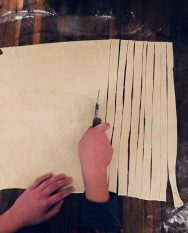 Cut the dough into 1-inch strips (recipe for how to make spiraled danish pastries by Stacy Lyn Harris)