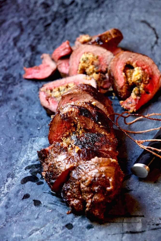 Picture of stuffed venison loin, recipe by Stacy Lyn Harris, to give examples of stuffed venison dishes using the butterflying and trussing technique