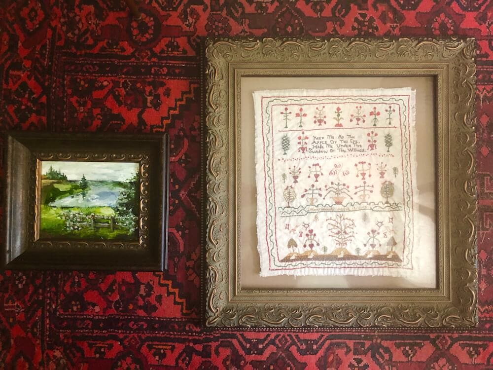 A picture of home decor and artwork in Stacy Lyn Harris's restful bedroom, from her blog on How to Create a Restful Bedroom