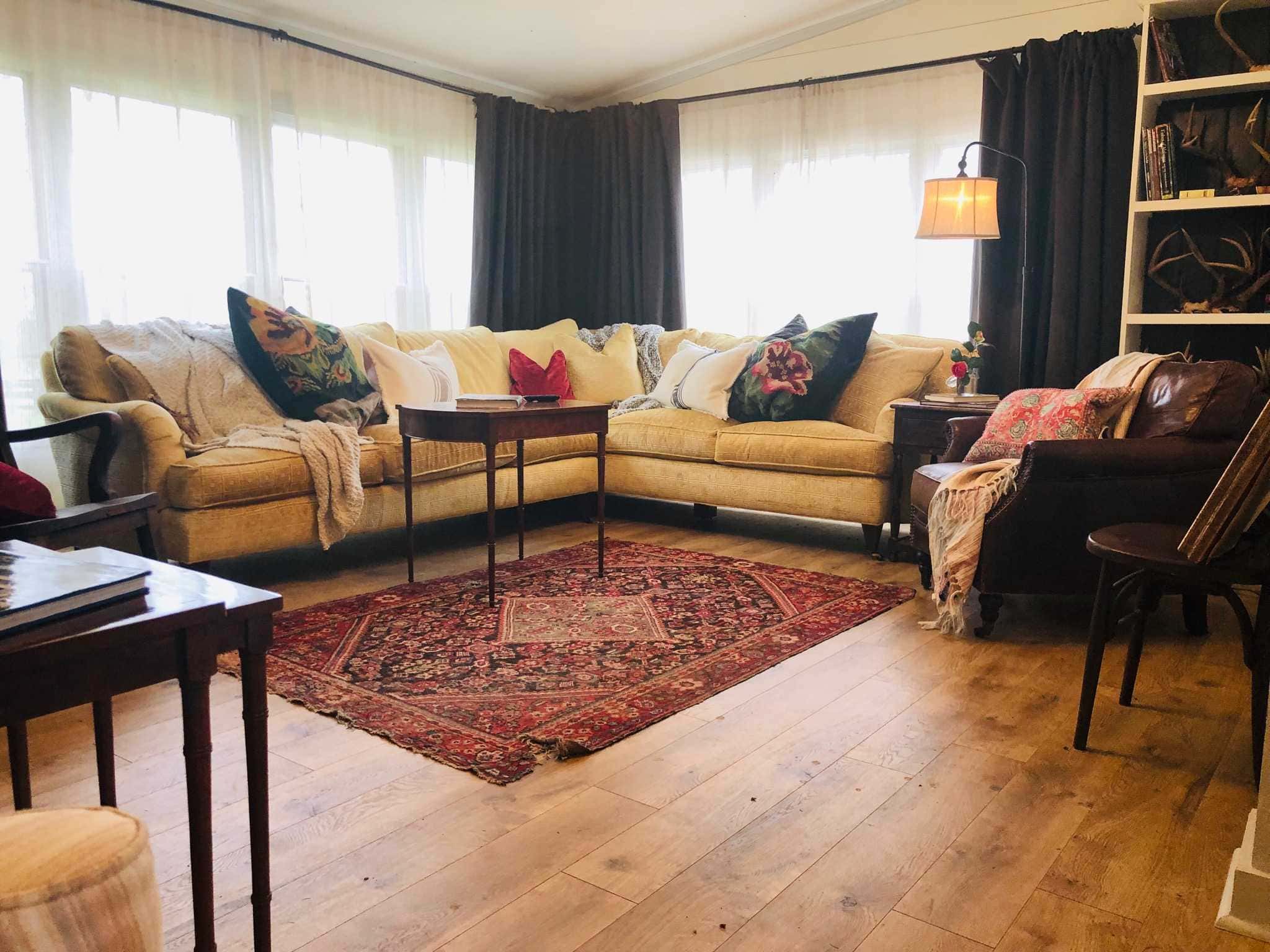 A shot of a living room at Stacy Lyn Harris's Purple Door house showing how she uses color in her accent pieces and furniture to make a cohesive interior design