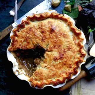 Southern squirrel pot pie with a slice removed, recipe by Stacy Lyn Harris from her Harvest Cookbook