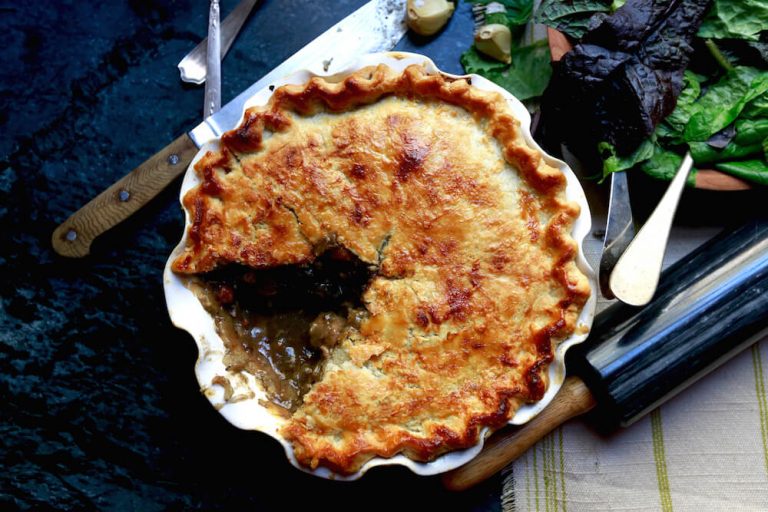 Southern squirrel pot pie with a slice removed, recipe by Stacy Lyn Harris from her Harvest Cookbook