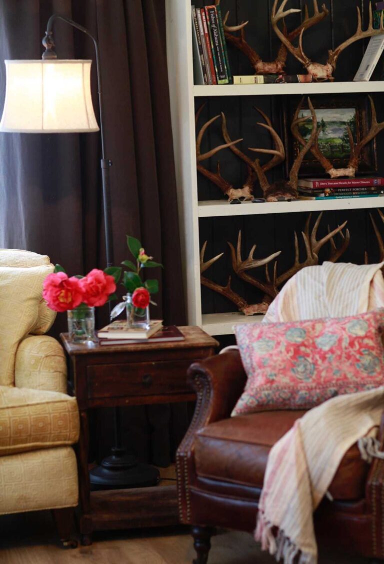 A shot of a living room at Stacy Lyn Harris's Purple Door house showing how she uses color in her accent pieces and furniture to make a cohesive interior design