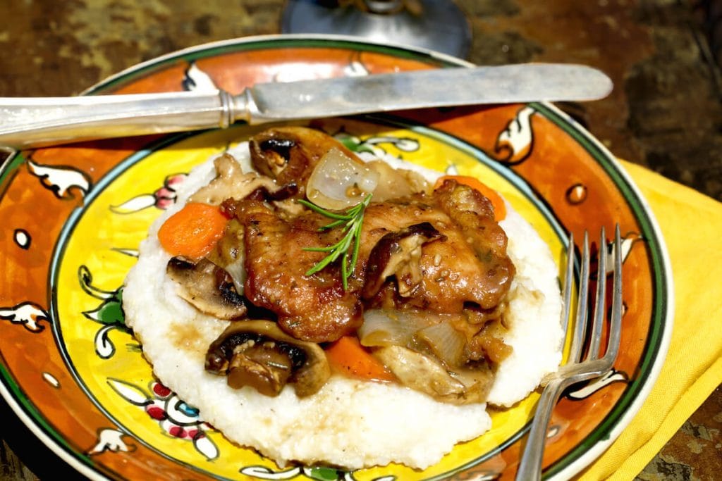 Picture of Chicken and Mushrooms over Cheesy Grits, recipe by Stacy Lyn Harris from her Harvest Cookbook