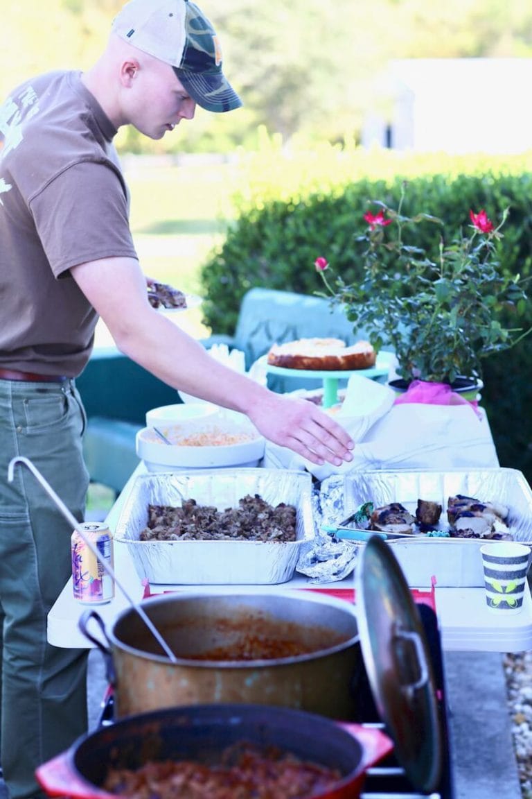 November party at the Stacy Lyn Harris household with all of her children's friends, playing corn hole and eating wild hog recipes