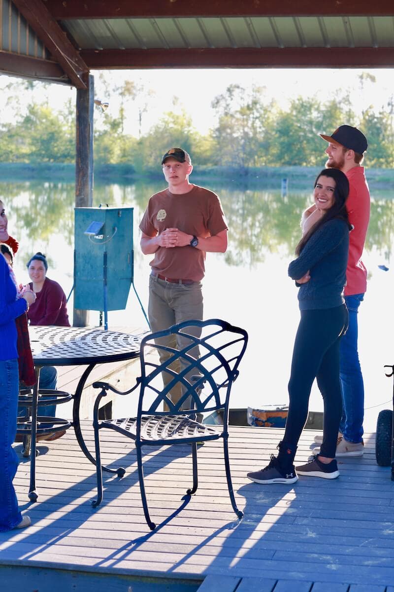 November party at the Stacy Lyn Harris household with all of her children's friends, playing corn hole and eating wild hog recipes