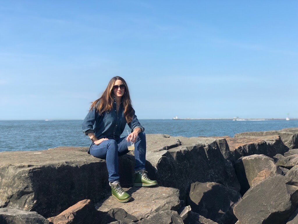 Stacy Lyn Harris posing for a photo on Lake Superior during her visit to the Lehman's facility in Ohio for the Country Living Workshop