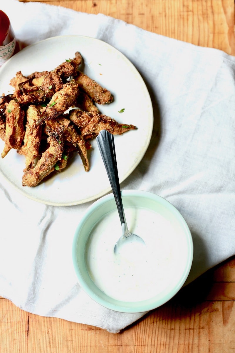 fried pickled okra with yogurt topping