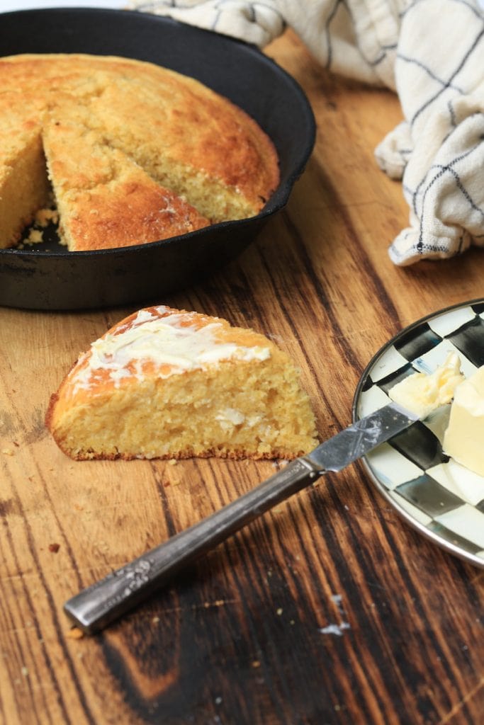 Sweet Cornbread with melted butter on wood