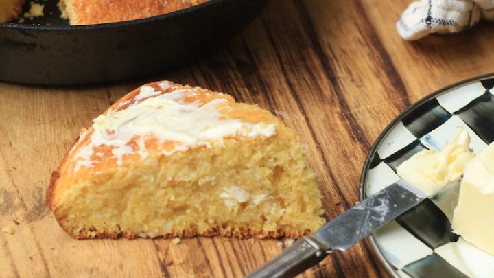 Sweet Cornbread with melted butter on wood