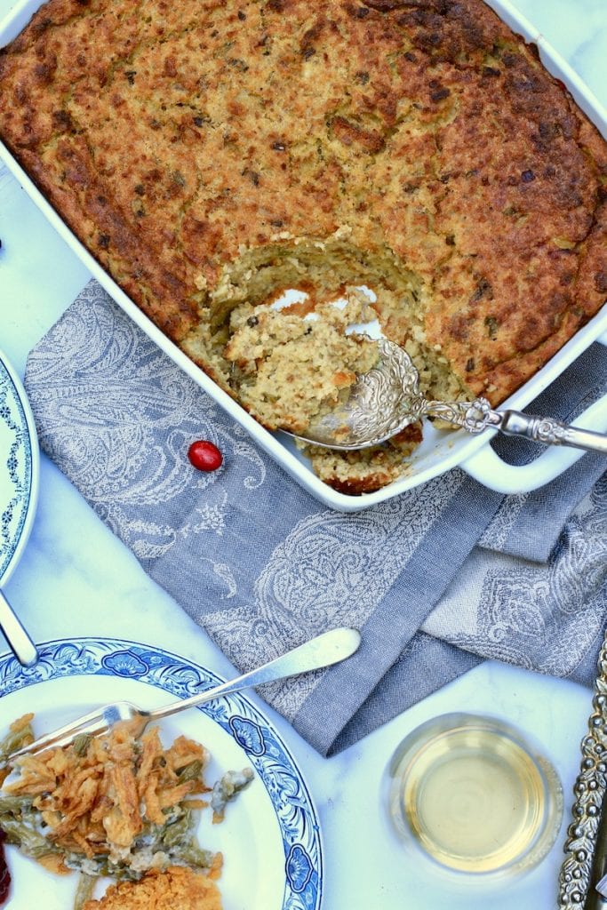 Thanksgiving Dressing in Rectangle Casserole Dish with Plate full of Casserole
