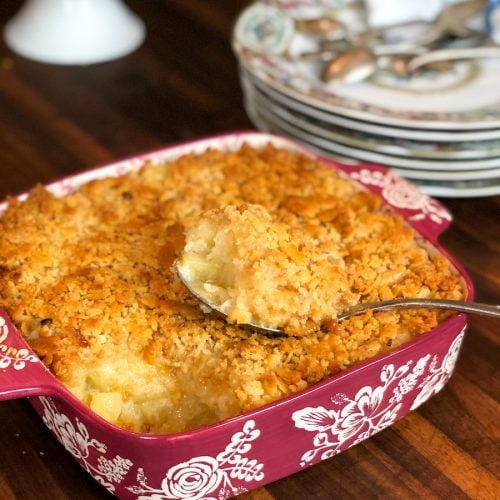 Classic Pineapple Casserole in Dish with China Plates in background