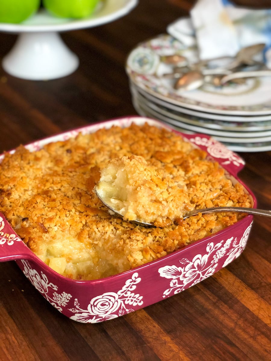 Classic Pineapple Casserole in Dish with China Plates in background