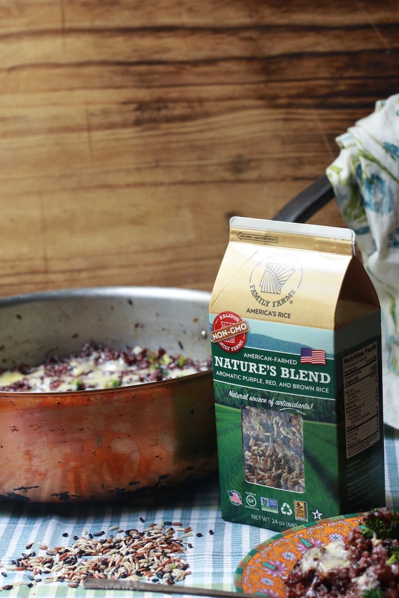 Nature's Blend Wild Rice package with rice on a checked napkin
