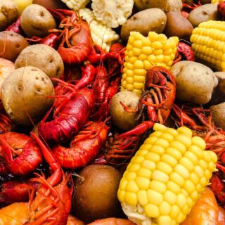Very close up of crawfish, corn, and potatoes after crawfish boil