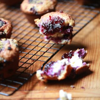baked mixed berry muffins on cooling rack