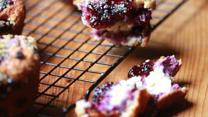 baked mixed berry muffins on cooling rack