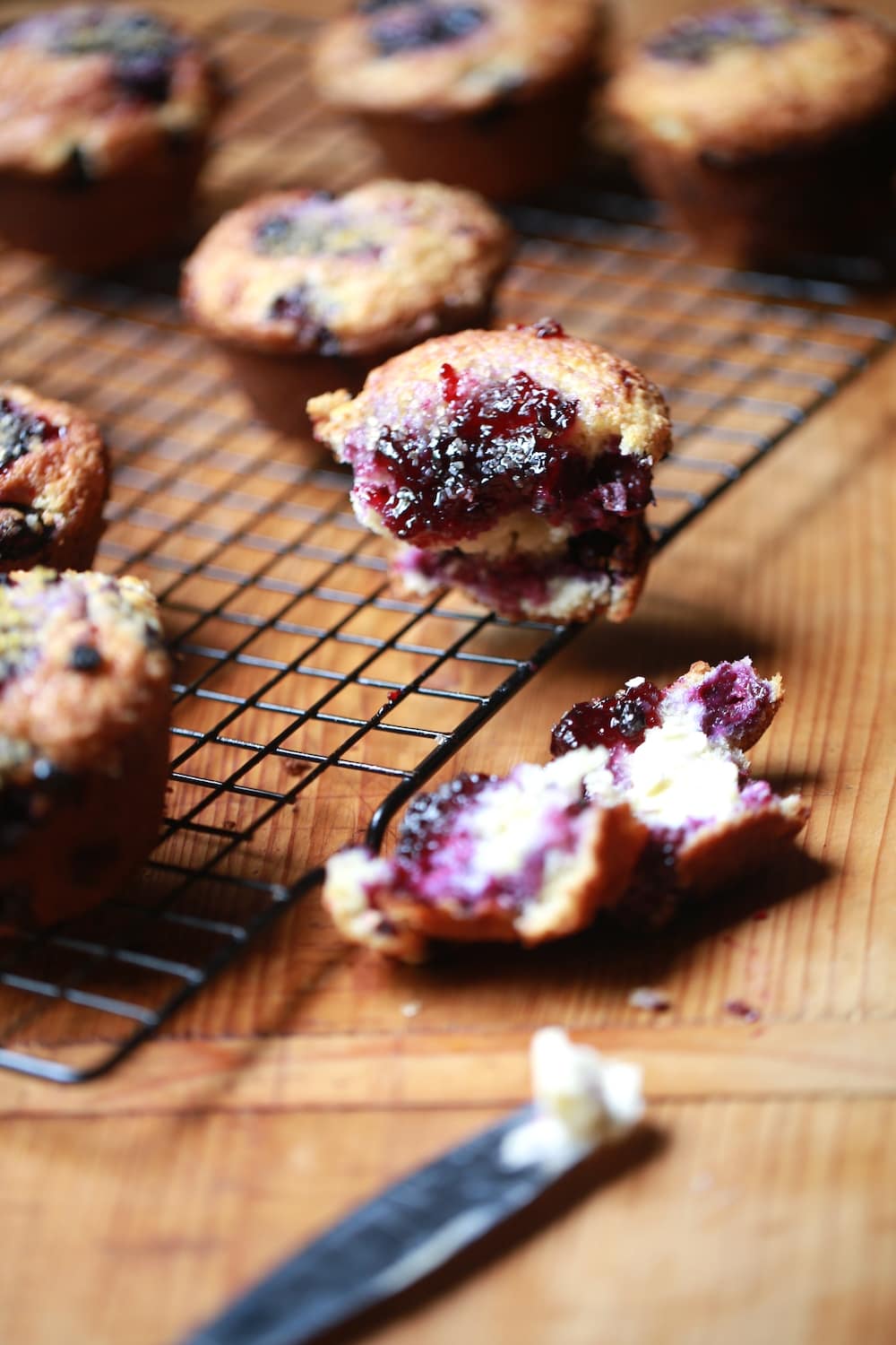 baked mixed berry muffins on cooling rack