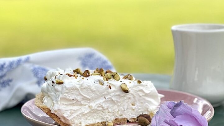 Pineapple pie on green table with silver fork outside