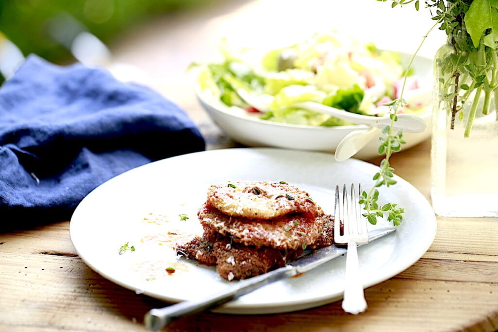 venison parmesan served with salad
