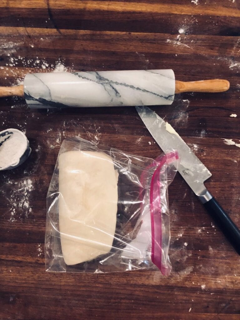 Fold dough on top of itself like a letter and place in a zip-top bag or wrap in plastic wrap and refrigerate for at least an hour.