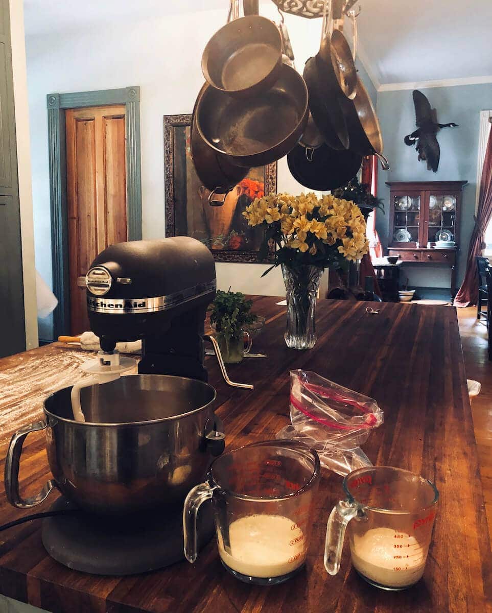 Add dry ingredients to the mixer, prepare the yeast mixture and milk, and allow the yeast to start working.