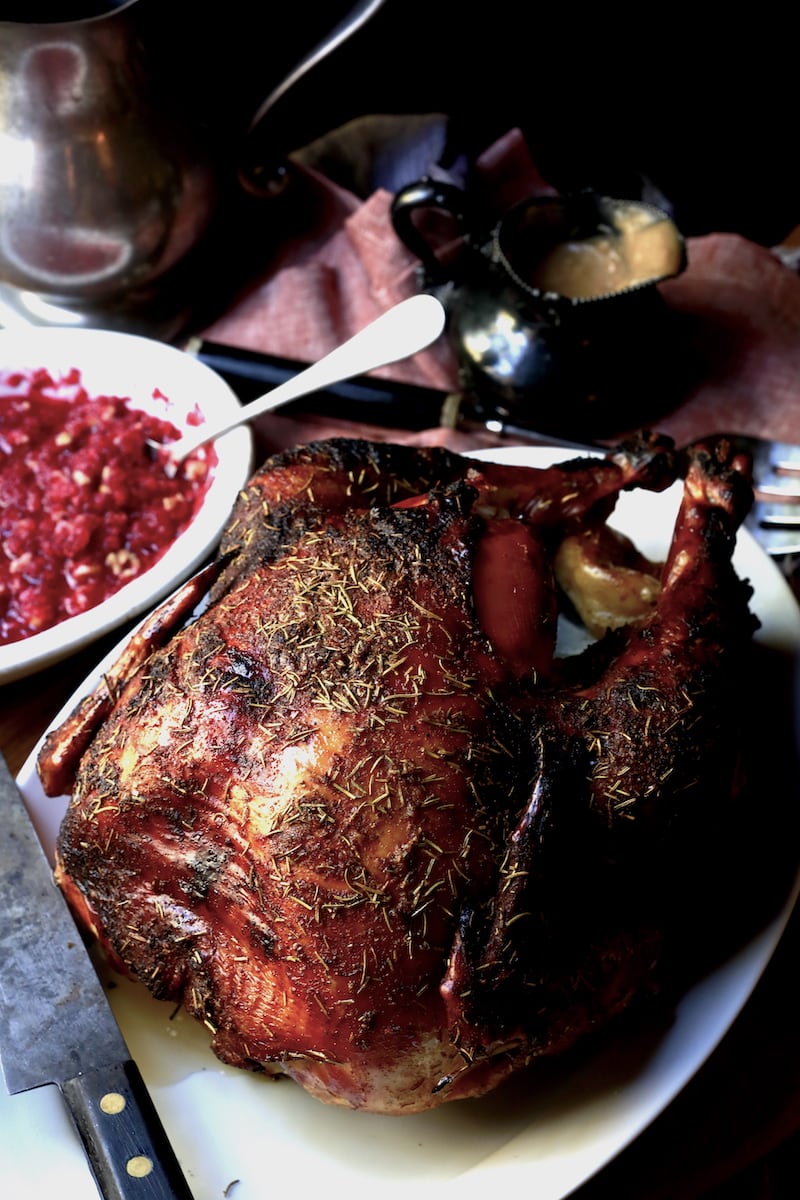 whole roasted Thanksgiving turkey on white plate